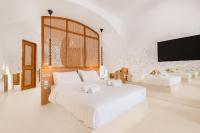A bed or beds in a room at Faos Exclusive Suites