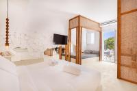 A bed or beds in a room at Faos Exclusive Suites