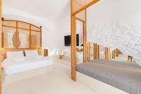 A bed or beds in a room at Faos Exclusive Suites