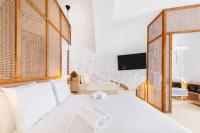 A bed or beds in a room at Faos Exclusive Suites