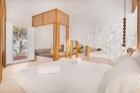 A bed or beds in a room at Faos Exclusive Suites