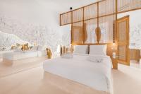 A bed or beds in a room at Faos Exclusive Suites