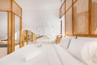 A bed or beds in a room at Faos Exclusive Suites