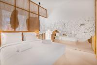 A bed or beds in a room at Faos Exclusive Suites