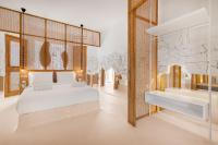 A bed or beds in a room at Faos Exclusive Suites