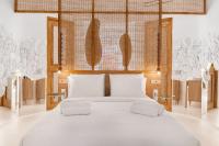 A bed or beds in a room at Faos Exclusive Suites