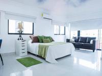 Postel nebo postele na pokoji v ubytování Room in Condo - Malecon Cozy - Premium Plus 19