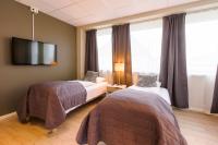 Postel nebo postele na pokoji v ubytování Corner Hotell