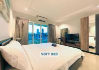 Postel nebo postele na pokoji v ubytování Nalanta Hotel Pattaya