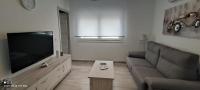 TV a/nebo společenská místnost v ubytování Apartamentos Sol y Luna Conil