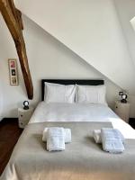 Posteľ alebo postele v izbe v ubytovaní Loft à Pont-Aven, Vue panoramique sur l'Aven