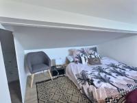 Łóżko lub łóżka w pokoju w obiekcie L'Harmonieux Fontenay Sous Bois