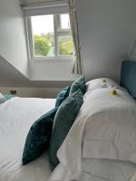 Postel nebo postele na pokoji v ubytování Tides Reach Guest House