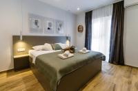 Postel nebo postele na pokoji v ubytování Apartments KIWI