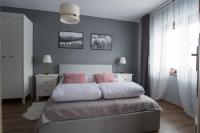 Posteľ alebo postele v izbe v ubytovaní Apartament Henrykówka Apartzakop