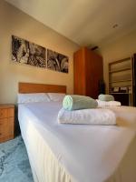 A bed or beds in a room at Premium Center Alameda