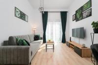 Televízia a/alebo spoločenská miestnosť v ubytovaní Exclusive Apartment Kajdasza Wroclaw by Noclegi Renters