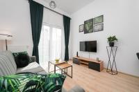 Televízia a/alebo spoločenská miestnosť v ubytovaní Exclusive Apartment Kajdasza Wroclaw by Noclegi Renters