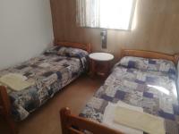 A bed or beds in a room at Albergue Santa Ana