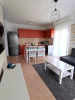 A kitchen or kitchenette at Sea Breeze Apartment