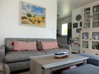 a living room with a couch and a table at Maison Le Tour-du-Parc, 4 pièces, 6 personnes - FR-1-639-51 in Le Tour-du-Parc