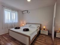 Posteľ alebo postele v izbe v ubytovaní Apartmani Peco Duće