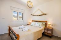 Posteľ alebo postele v izbe v ubytovaní Aronia Luxury Apartments Karpathos