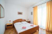 Postel nebo postele na pokoji v ubytování Apartments Nataša