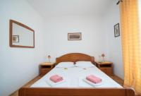 Postel nebo postele na pokoji v ubytování Apartments Nataša