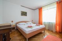 Postel nebo postele na pokoji v ubytování Apartments Nataša