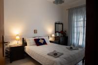 Posteľ alebo postele v izbe v ubytovaní Violetta's House Παραδοσιακή Βίλα στην Πορταριά