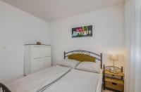 Postel nebo postele na pokoji v ubytování Apartment Tulipan