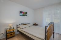 Postel nebo postele na pokoji v ubytování Apartment Tulipan