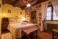 A bed or beds in a room at Fervenza Casa Grande & Restaurante