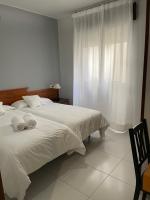 Postel nebo postele na pokoji v ubytování Hotel Venezuela