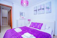 A bed or beds in a room at 075 Altos Magic House - Alicante Holiday
