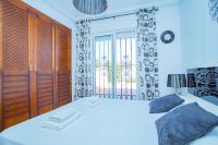 A bed or beds in a room at 075 Altos Magic House - Alicante Holiday