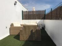 Posedenie v ubytovaní Tomares Townhouse