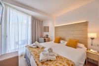 Łóżko lub łóżka w pokoju w obiekcie Hotel Ilusion Moreyo - Adults Only