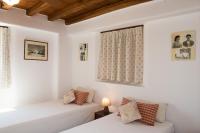 Postel nebo postele na pokoji v ubytování Villa Abella Paraga Mykonos, Traditional with amazing sea view, up to 6 people