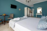 Postel nebo postele na pokoji v ubytování Evi Boutique Rooms