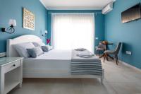 Postel nebo postele na pokoji v ubytování Evi Boutique Rooms