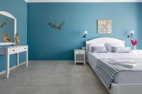 Postel nebo postele na pokoji v ubytování Evi Boutique Rooms