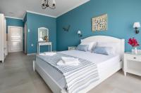 Postel nebo postele na pokoji v ubytování Evi Boutique Rooms