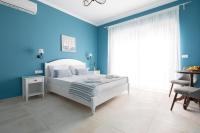 Postel nebo postele na pokoji v ubytování Evi Boutique Rooms