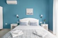 Postel nebo postele na pokoji v ubytování Evi Boutique Rooms