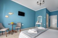 Postel nebo postele na pokoji v ubytování Evi Boutique Rooms