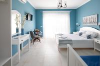 Postel nebo postele na pokoji v ubytování Evi Boutique Rooms