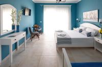 Postel nebo postele na pokoji v ubytování Evi Boutique Rooms