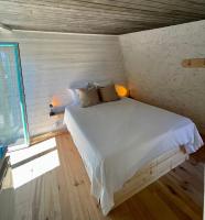 a bedroom with a white bed in a room with a window at Little California - Adorable Studio Indépendant in Cagnes-sur-Mer